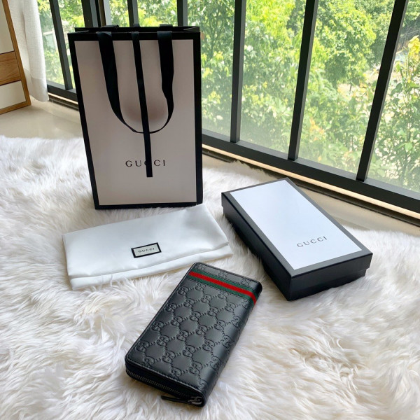 G*u*i leather zip around wallet