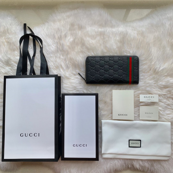 G*u*i leather zip around wallet