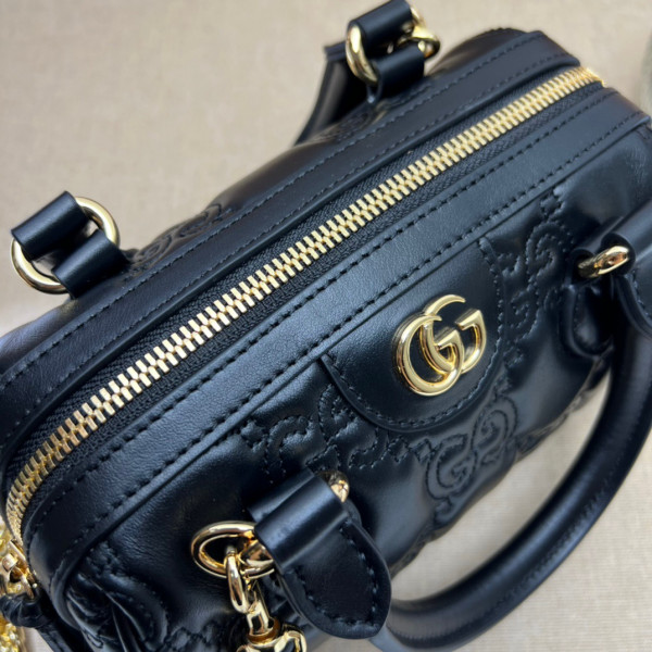 G*u*i gg matelassé leather top handle bag