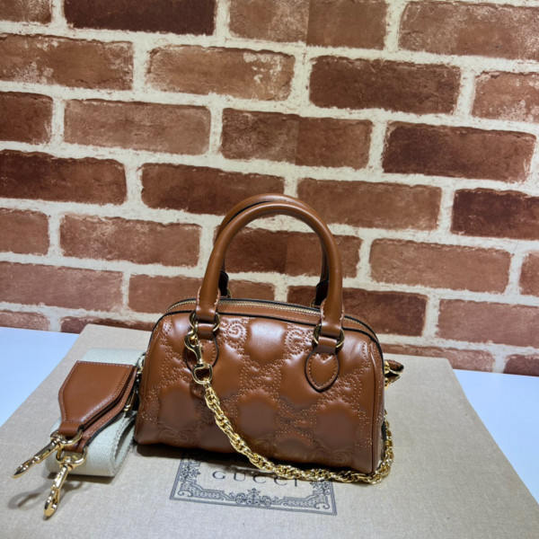 G*u*i gg matelassé leather top handle bag