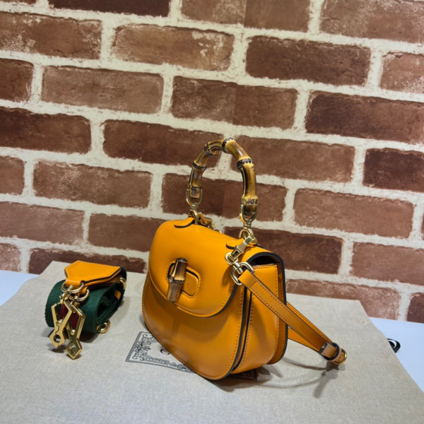G*u*i mini top handle bag with bamboo