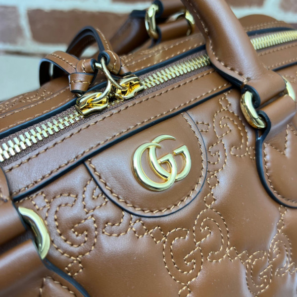 G*u*i gg matelassé leather top handle bag