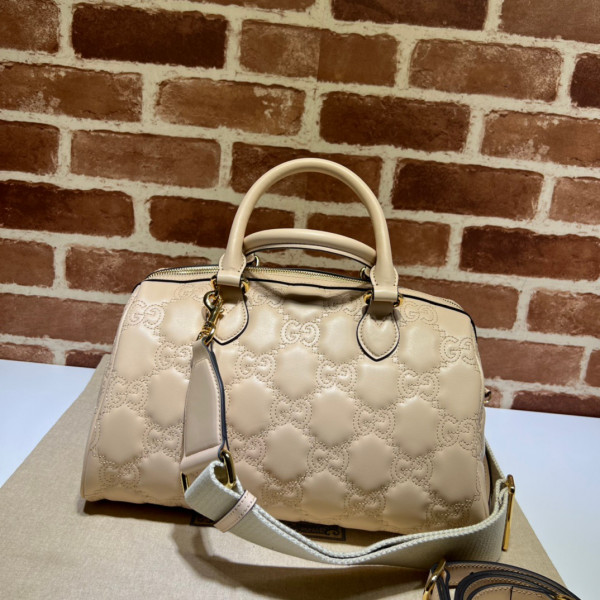 G*u*i gg matelassé leather top handle bag