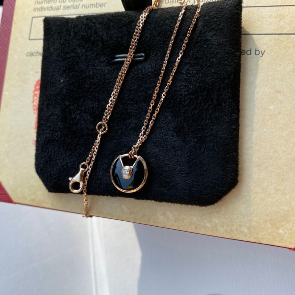 Ca*t*er  amulet necklace