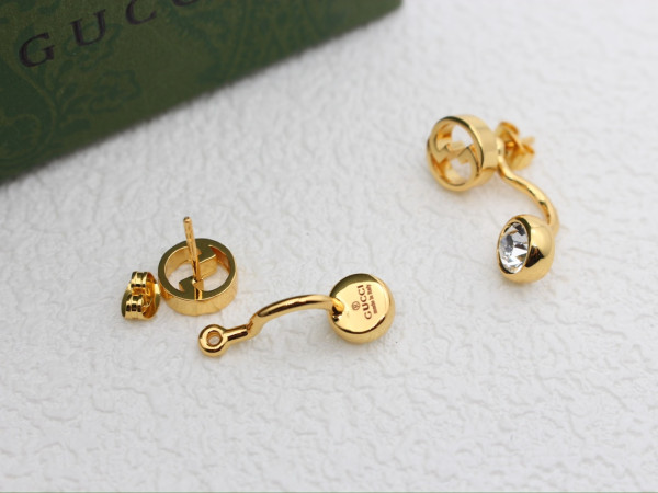 G*u*i earrings